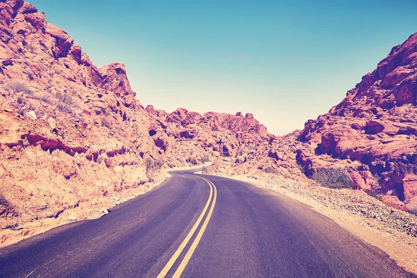 Retro stylized deserted canyon road, Nevada, USA. — Stock Photo, Image