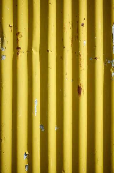 Weathered corrugated yellow rusty metal wall. — Stock Photo, Image