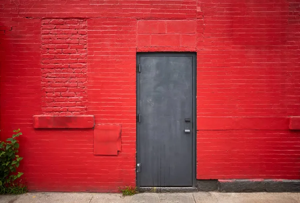 Steel door in an old red brick wall — Stock Photo, Image