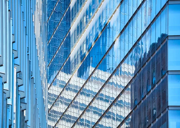 Modern buildings reflected in glass facades. — Stock Photo, Image