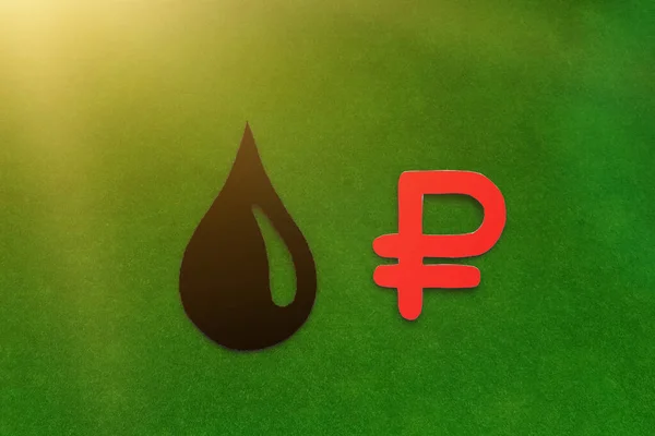 A black drop of oil, a red ruble sign on a green background. Oil and petroleum products market.