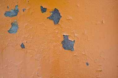 Turuncuya boyanmış demir bir yaprağın dokusu. Zamandan kalma çürüme izleri var.