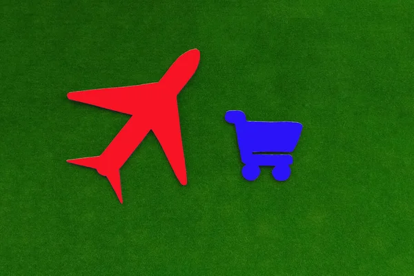 飛行機は 緑の背景にスーパーマーケットトロリーから 航空機による貨物の輸送及び引渡し — ストック写真