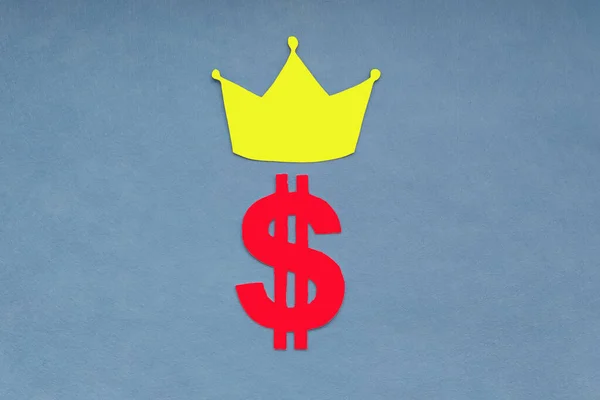 Crown, dollar sign on a blue background. Currency funds, dollar exchange rate.