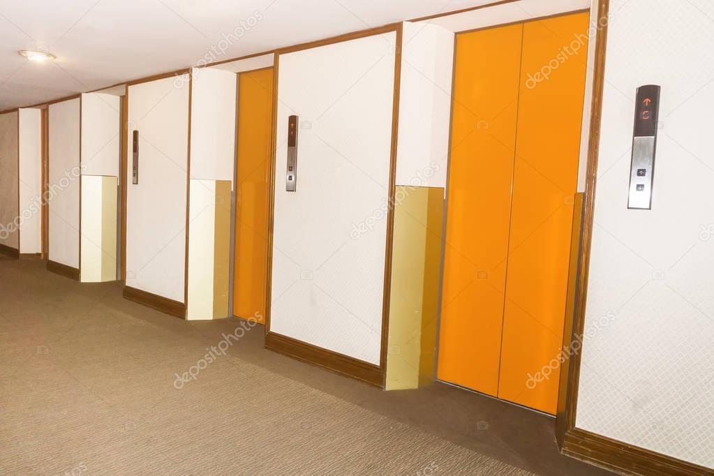 elevators orange color in hotel lobby