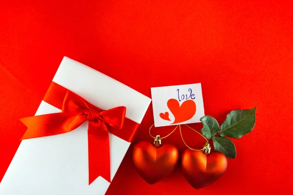 Valentines gift box with a red bow on red background Image of Va — Stock Photo, Image