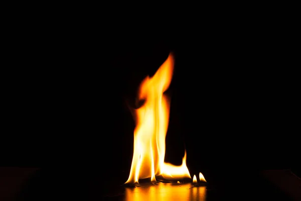 Burning fire flame on black background — Stock Photo, Image