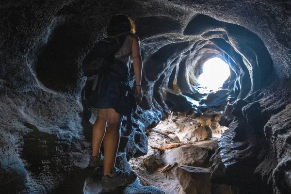 woman in cave in Sequoia National Park, the beautiful sequoias, California, United States