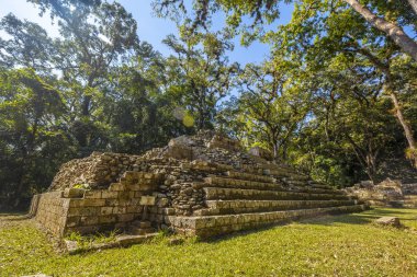 woman at Mayan pyramid in The Copan Ruins temples, Honduras