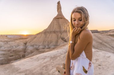  young beautiful woman in the desert of the Bardenas Reales, Navarra, Spain clipart