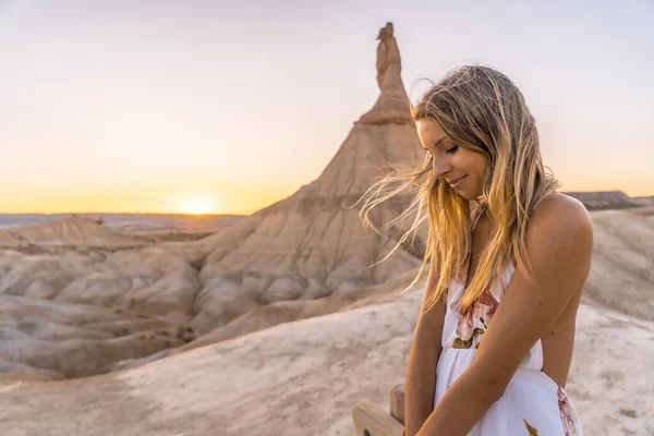 young beautiful woman in the desert of the Bardenas Reales, Navarra, Spain