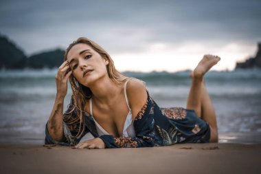  portrait of beautiful young woman in bikini at sea shore
