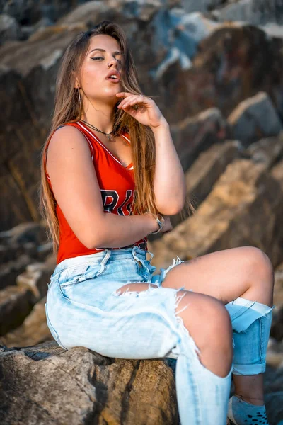 portrait of beautiful young woman at sea shore