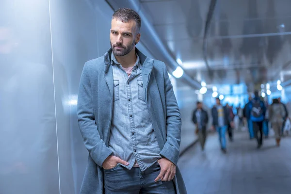 portrait of attractive young man in coat