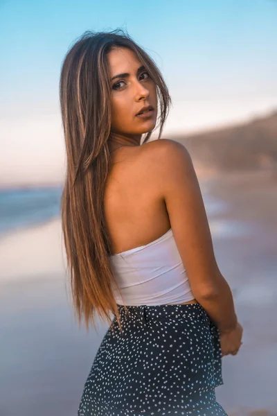 fashion portrait of attractive young woman at beach of Zarautz