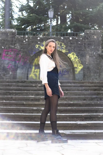 stock image Stylish young woman posing on stairs 