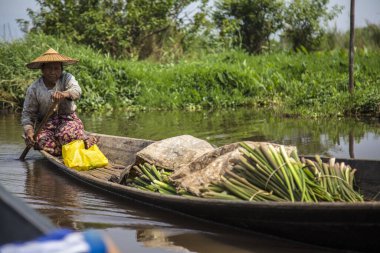 Inle Lake, Myanmar - Spring, 2018: Inside a nice boat with local people in the Inle Lake of Myanmar