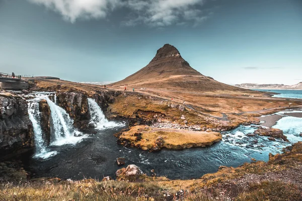 Waterfall and lonely mountain icon of Kirkjufell Iceland