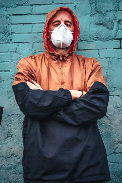 Young Man Mask Hood Leaning Wall Staring Intently First Walks — Stock Photo, Image
