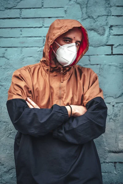 Young Man Mask Hood Leaning Wall First Walks Uncontrolled Covid — Stock Photo, Image