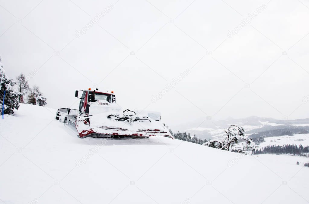 Snow groomer rides to work