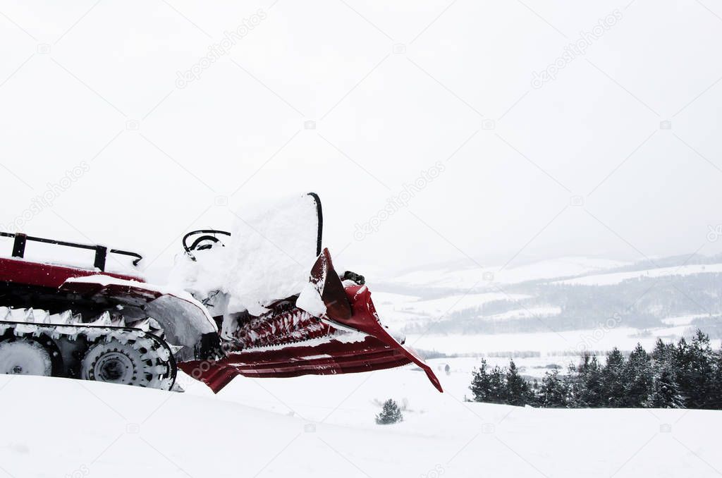 Snow groomer rides to work