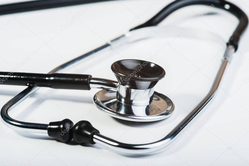 Medical stethoscope on a white background.