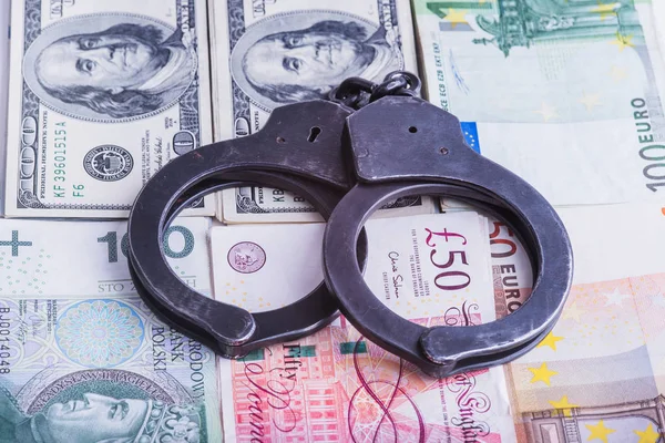 Handcuffs, money and gun. — Stock Photo, Image