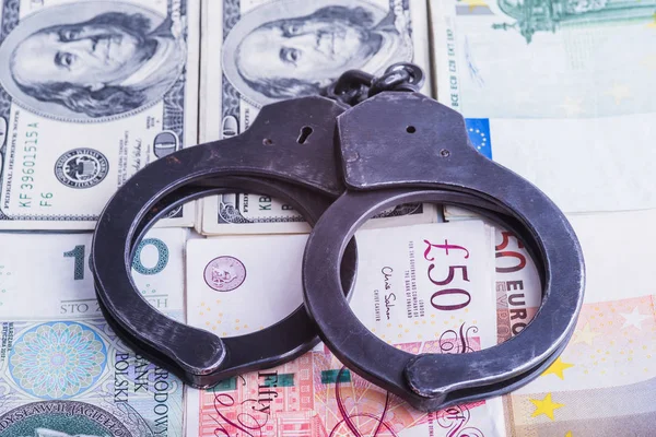 Handcuffs, money and gun. — Stock Photo, Image