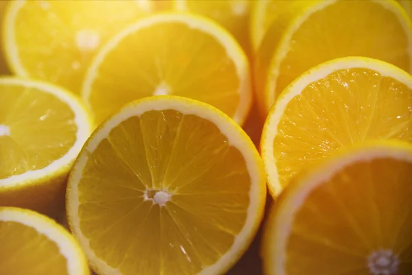 Sliced yellow juicy lemons background