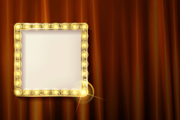 Подвесная золотая рамка на красном занавесе
