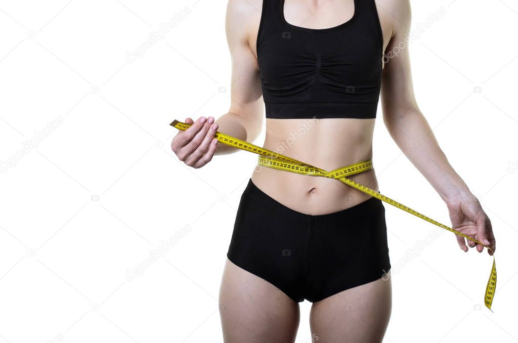 Young woman measuring waist with measuring tape, isolated on whi