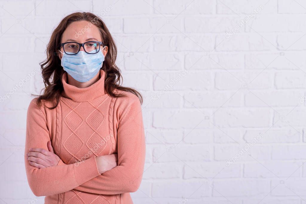 Young woman in a medical mask. Viral epidemic.