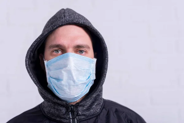 Portrait of a man in a medical mask. Pandemic. Epidemic. Coronavirus.