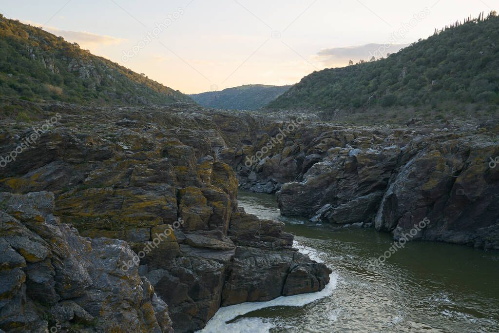 Pulo do Lobo waterfall with river guadiana and rock details at sunset in Mertola Alentejo, Portugal