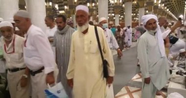 Muslims praying inside haram Masjid (mosque) Nabawi in Al Madinah, Saudi Arabia