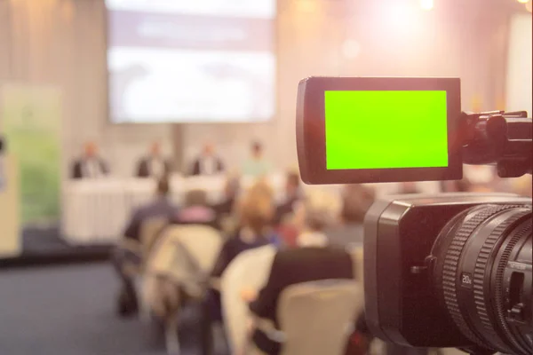 Digital video camera recording event. Business conference or sem