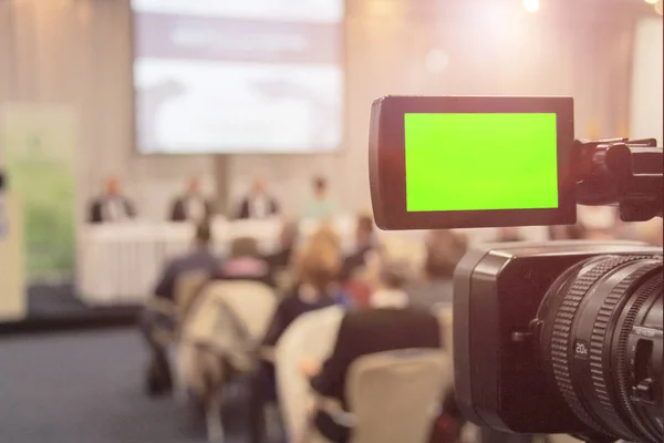 Digital video camera recording event. Business conference or sem
