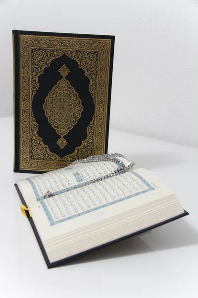 Holy islamic book Koran and rosary