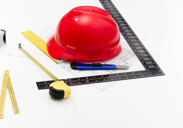 Helmet and tools for construction drawings and buildings — Stock Photo, Image