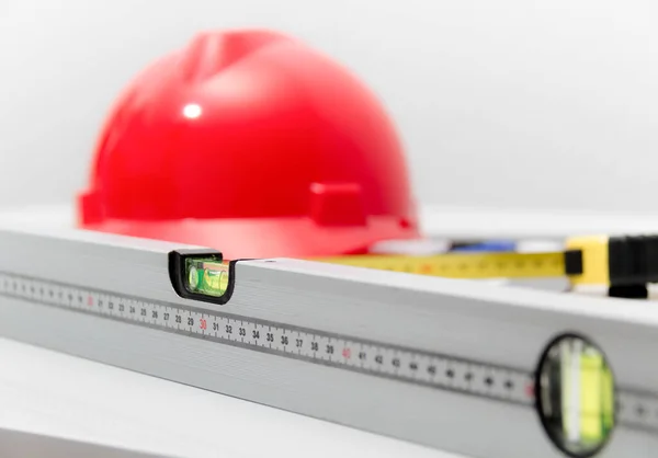 Helmet and tools for construction drawings and buildings — Stock Photo, Image