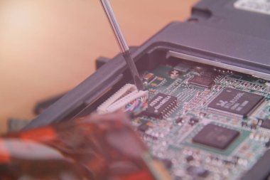 Computer service. Man repairing notebook at the table