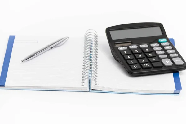 Geschäftskonzept mit Taschenrechner, Stift und Notizbuch — Stockfoto