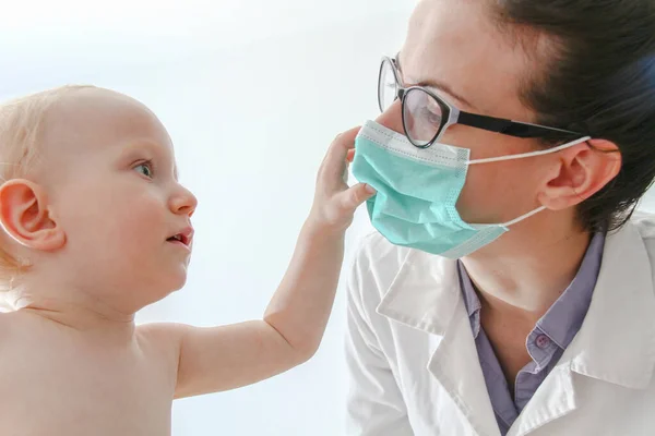 One year old sick baby boy at the young female doctor — ストック写真