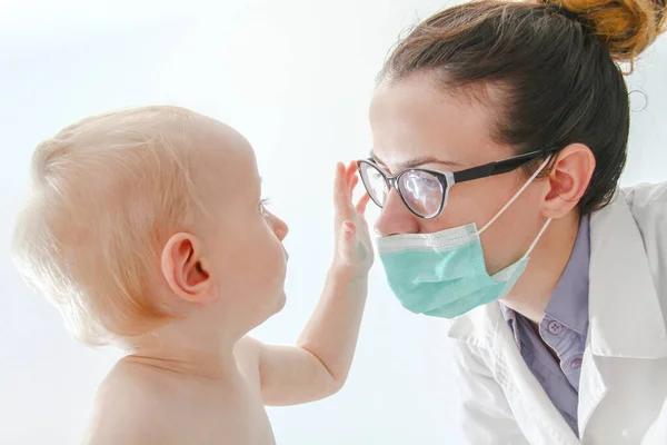 One year old sick baby boy at the young female doctor — 스톡 사진