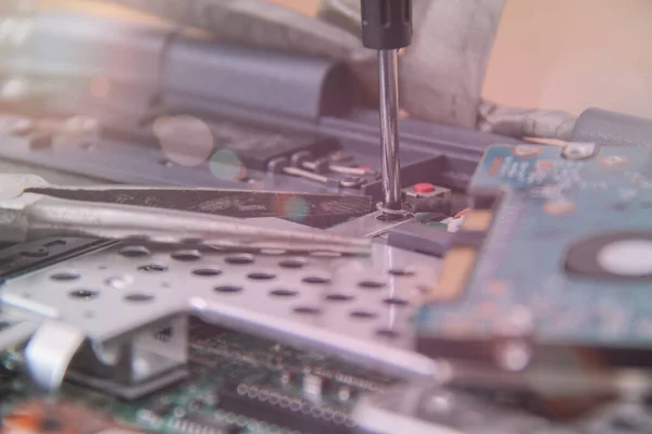 Computer service. Man repairing notebook at the table — 스톡 사진