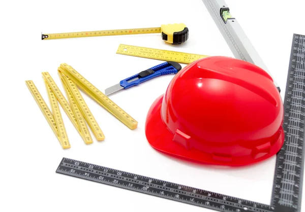 Helmet and tools for construction drawings and buildings — Stock Photo, Image