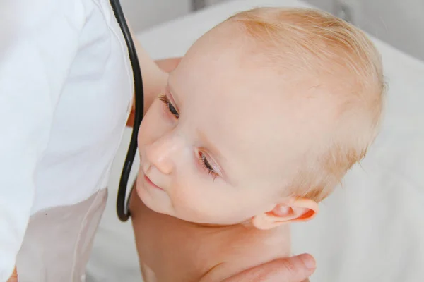 One year old sick baby boy at the young female doctor — Stock Fotó