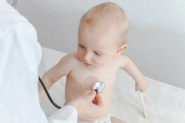 One year old sick baby boy at the young female doctor — 스톡 사진