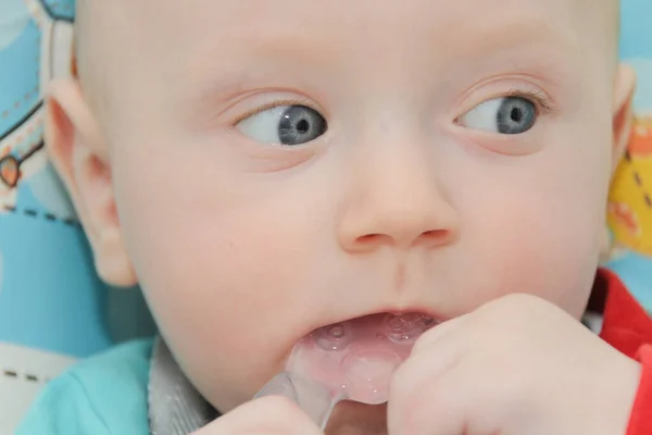 Cute little baby boy is playing with toys — ストック写真